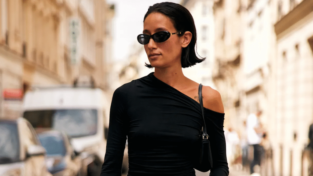 woman wearing a black off-the-shoulder top in New York