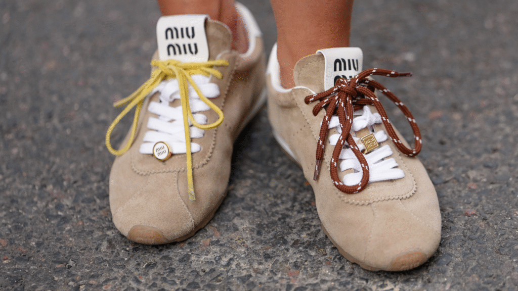 woman wearing suede Miu Miu sneakers