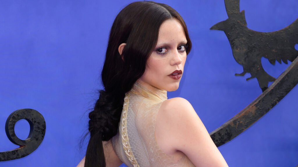 Jenna Ortega on a red carpet wearing a couture dress that she would later change out of and into a slip