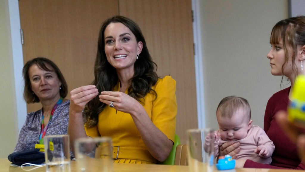 Kate Middleton wears a yellow dress to visit the Royal Surrey County Hospital's Maternity Unit on October 5, 2022