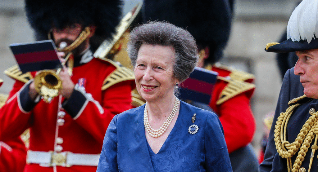 Princess Anne wears a pearl necklace and blue dress