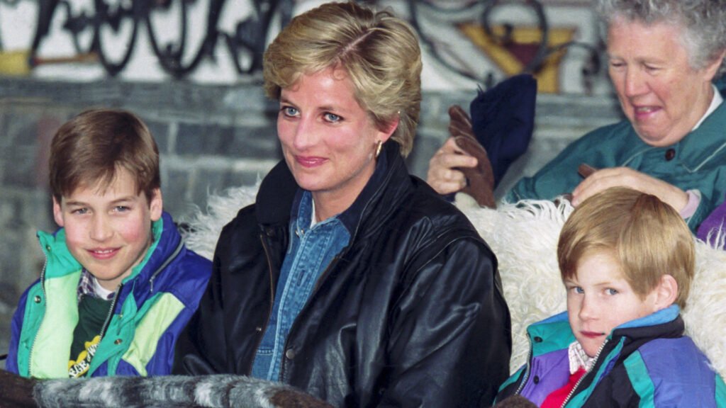 Prince William, Princess Diana, and Prince Harry ride in a sleigh