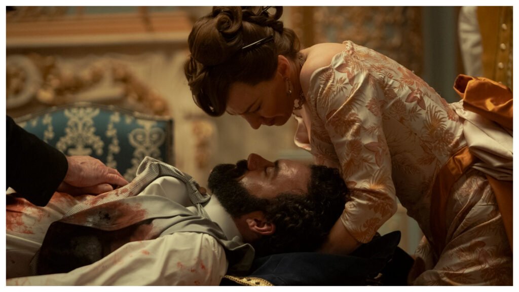 george russell bloodied and laying under bertha russell in a still from the gilded age season 3 finale