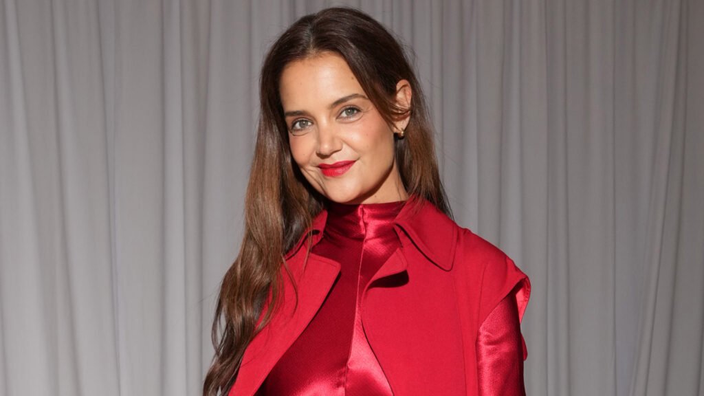 Katie Holmes weres a bright red long-sleeve gown to attend the FFORME S/S26 Show during New York Fashion Week on September 12, 2025