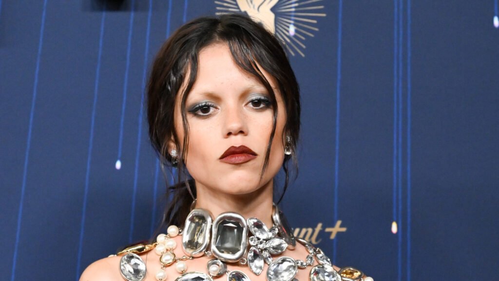 Jenna Ortega wearing red lipstick at the 2025 emmys