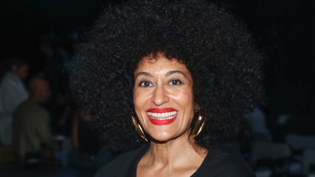 Tracee Ellis Ross wearing red lipstick and her afro hairstyle