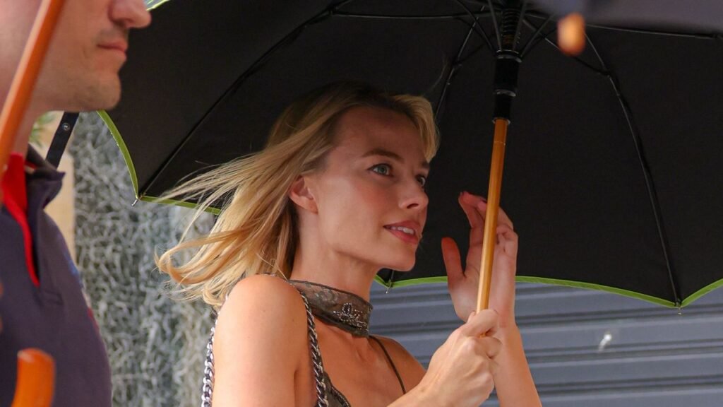 In Rainy Paris, Margot Robbie Finds the Chicest Possible Solution